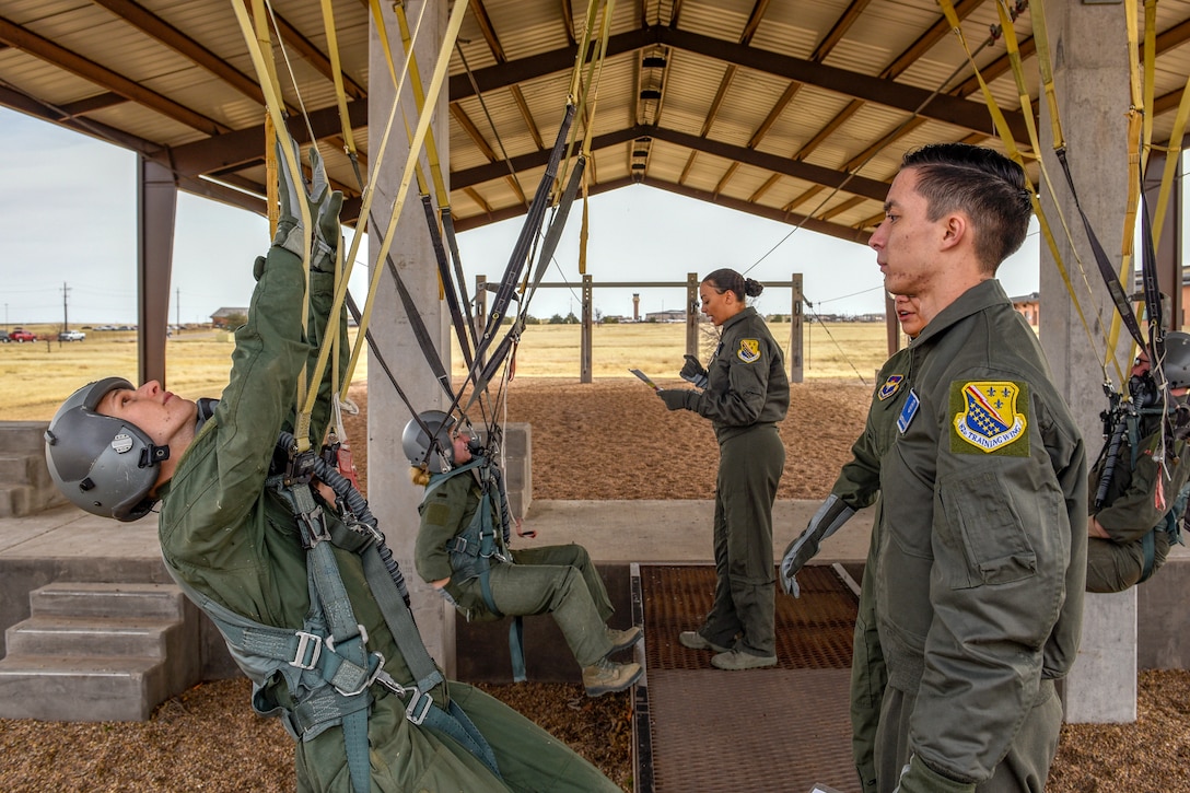 Airmen learn how to use parachutes.