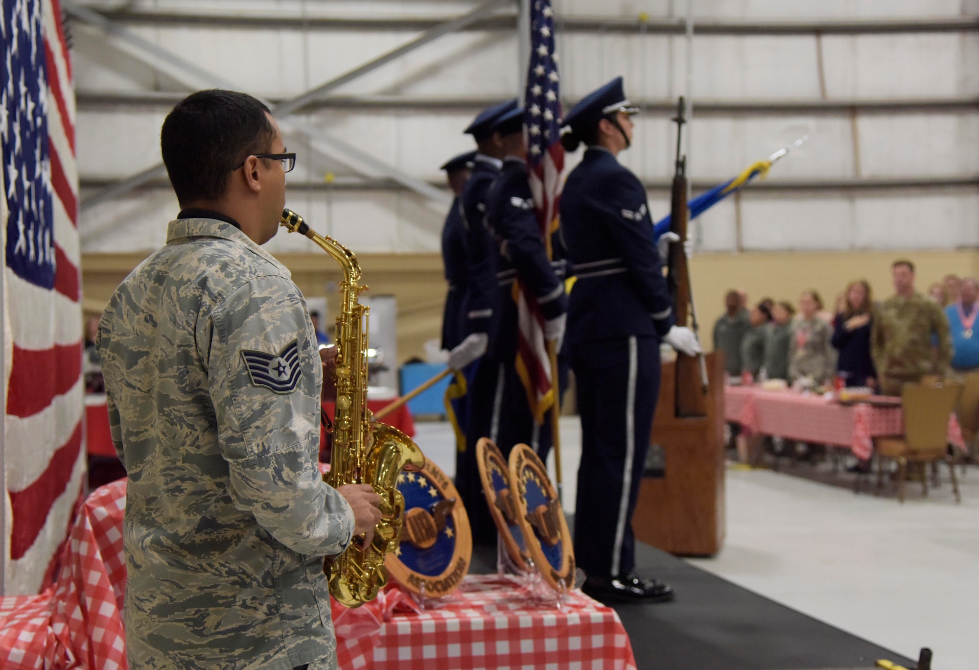 U.S. Air Force Tech. Sgt. Javier Trujillo, 334th Training Squadron instructor, plays the national anthem with his saxophone during the 81st Training Wing's 2018 Annual Awards Ceremony inside a hangar at Keesler Air Force Base, Mississippi, Feb. 1, 2019. During the ceremony, base leadership recognized outstanding Airmen and civilians from across the installation for their accomplishments throughout 2018. (U.S. Air Force photo by Kemberly Groue)