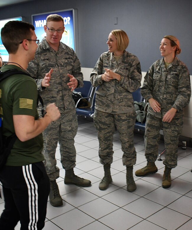 932nd Airlift Wing members were on hand to welcome back several Airmen recently, including deployer, Senior Airman Tyler Hambidge, at left, from the 932nd Medical Group. Giving him a verbal welcome upon arrival back in Illinois on January 29, 2019, is Senior Master Sgt. Wayne Cantwell, the superintendent of the 932nd MDG. The 932nd AW is an Air Force Reserve Command unit located at Scott Air Force Base, Illinois.  The mission of the wing is to provide unrivaled mission ready Citizen Airmen, and they come to train in Illinois from 37 different states.  (U.S. Air Force photo by Lt. Col Stan Paregien)