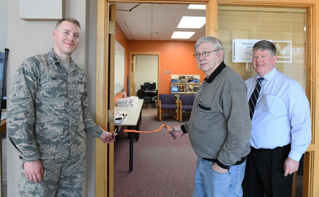 A ribbon is cut to officially open the tax center at Ellsworth Air Force Base, S.D., Feb. 1, 2019. The tax center helps base members, retirees and military families file their 2018 tax forms for free. U.S. Air Force photo by Airmen 1st Class Thomas Karol)