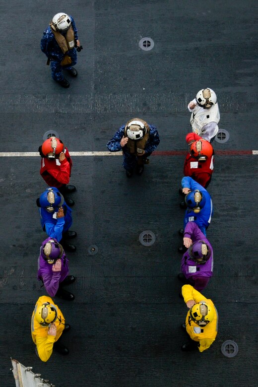 EAST CHINA SEA (Feb. 5, 2019) Commander in Chief of Self Defense Fleet, Japan Maritime Self Defense Force (JMSDF), Vice Adm. Kazuki Yamashita renders a salute through side boys on the flight deck of the amphibious assault ship USS Wasp (LHD 1) during a visit between U.S. and Japan military officials to observe amphibious operations at sea. Wasp, flagship of the Wasp Amphibious Ready Group, with embarked 31st Marine Expeditionary Unit, is operating in the Indo-Pacific region to enhance interoperability with partners and serve as a ready-response force for any type of contingency.