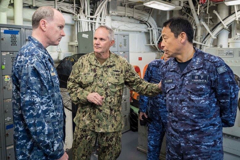 EAST CHINA SEA (Feb. 5, 2019) Commander of U.S. 7th Fleet, Vice Adm. Phil Sawyer (center), and Commander in Chief of Self Defense Fleet, Japan Maritime Self Defense Force (JMSDF), Vice Adm. Kazuki Yamashita (right) meets with the Commanding Officer of the amphibious assault ship USS Wasp (LHD 1), Capt. Colby Howard, during a visit between U.S. and Japan military officials to observe amphibious operations at sea. Wasp, flagship of the Wasp Amphibious Ready Group, with embarked 31st Marine Expeditionary Unit, is operating in the Indo-Pacific region to enhance interoperability with partners and serve as a ready-response force for any type of contingency.