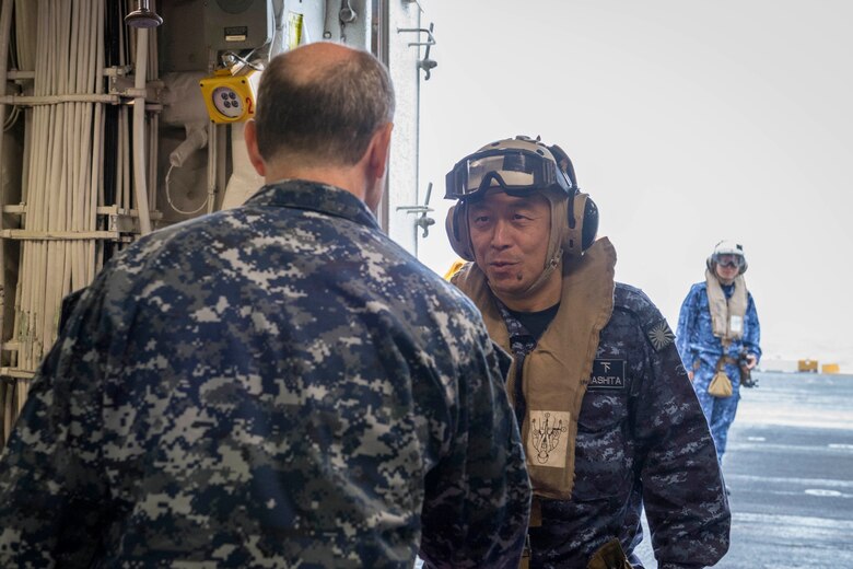 EAST CHINA SEA (Feb. 5, 2019) Commander in Chief of Self Defense Fleet, Japan Maritime Self Defense Force (JMSDF), Vice Adm. Kazuki Yamashita meets with the Commanding Officer of the amphibious assault ship USS Wasp (LHD 1), Capt. Colby Howard, during a visit between U.S. and Japan military officials to observe amphibious operations at sea. Wasp, flagship of the Wasp Amphibious Ready Group, with embarked 31st Marine Expeditionary Unit, is operating in the Indo-Pacific region to enhance interoperability with partners and serve as a ready-response force for any type of contingency.