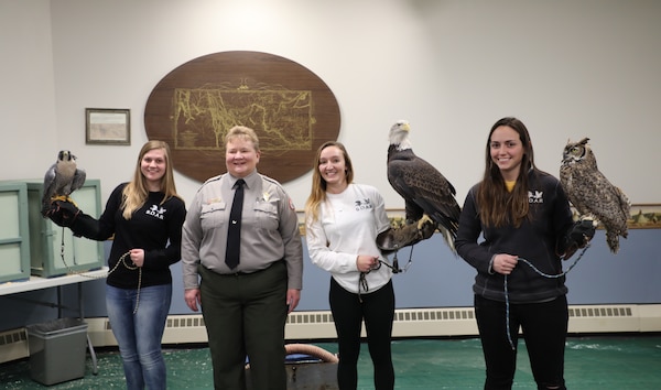 On the premises of the Lewis & Clark and Gavins Point Dam as part of the "Bald Eagle Days" USACE hosts annually. Park Ranger Karla Zeutenhorst introduces raptor rehabilitators from Saving Our Avian Resources (S.O.A.R), who provide a demonstration involving an owl, a peregrine falcon and a bald eagle Feb. 3, 2019. (Photo by Dr. Michael Izard-Carroll, USACE Omaha PAO)