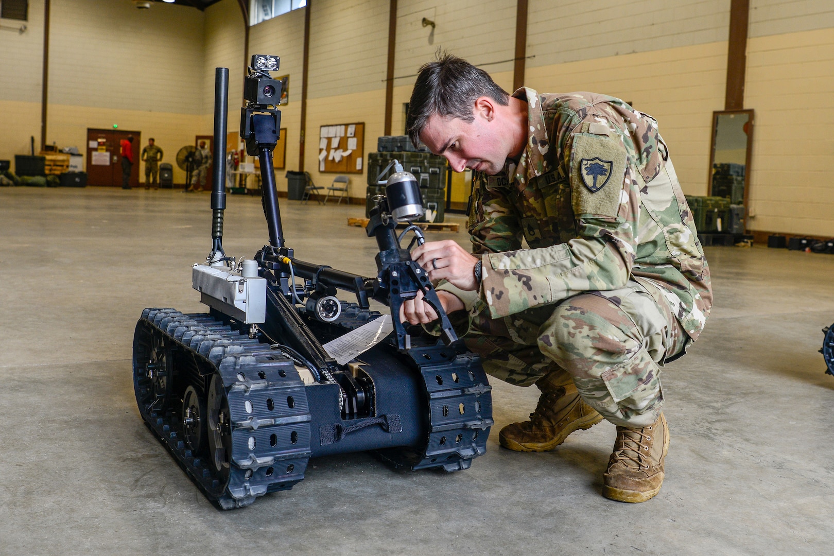 Army Staff Sgt. Kevin O’Conner, a combat engineer with the South Carolina Army National Guard's 122nd Engineer Clearance Company, examines parts of a Talon IV Reset robotic vehicle while conducting training at the unit's home station in Graniteville, S.C., in Oct. 2018.  In the coming years, Soldiers throughout the Army National Guard can expect to see a wider variety of robots with expanded capabilities to meet a number of missions sets. That may  include a golf cart-sized robot designed to carry a squad's equipment as well as advances in autonomous vehicles that follow a lead vehicle driven by Soldiers.