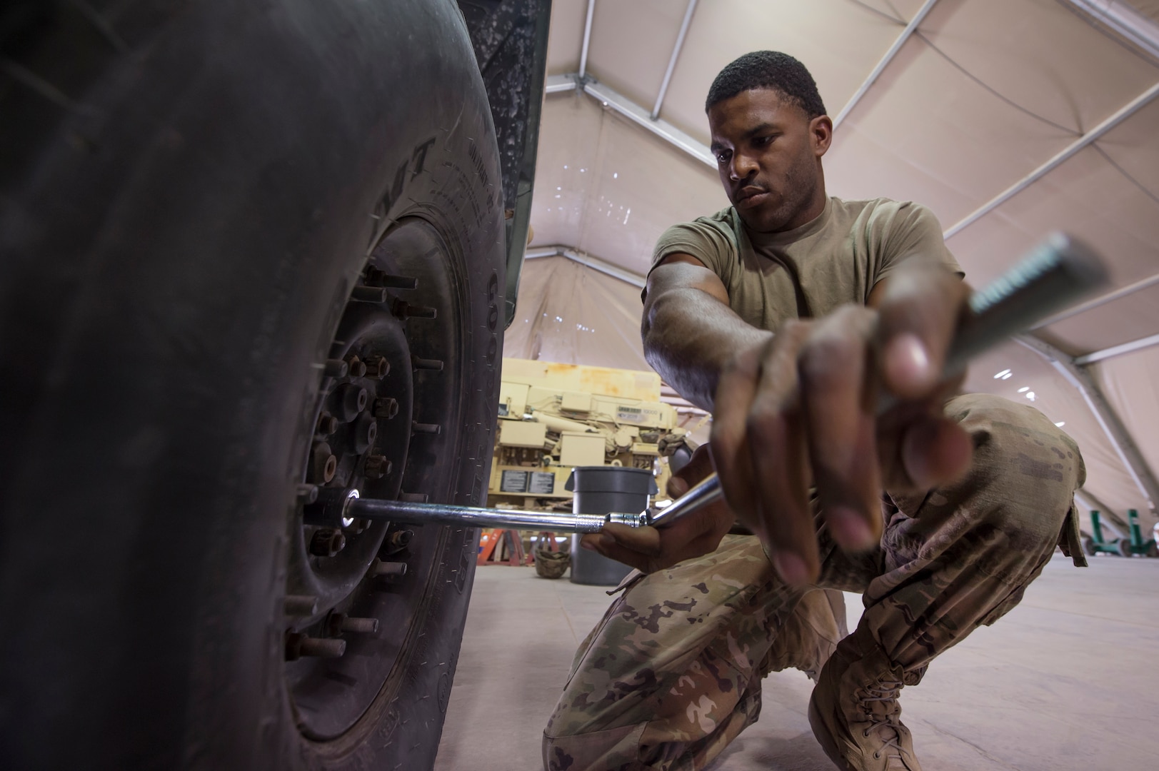 U.S. Army Spc. Jaylyn Wilson Echo Company, 1st Battalion, 43rd Air Defense Artillery (ADA) Battalion, 11th ADA Brigade wheeled vehicle mechanic, prepares a military vehicle’s tires for rotation as part of routine maintenance Jan. 28, 2019, at Al Udeid Air Base, Qatar. Soldiers of Echo Company perform mechanical work and repairs for various equipment and assets that support Al Udeid’s air defense capabilities, including surface-to-air missile systems. (U.S. Air Force photo by Tech. Sgt. Christopher Hubenthal)