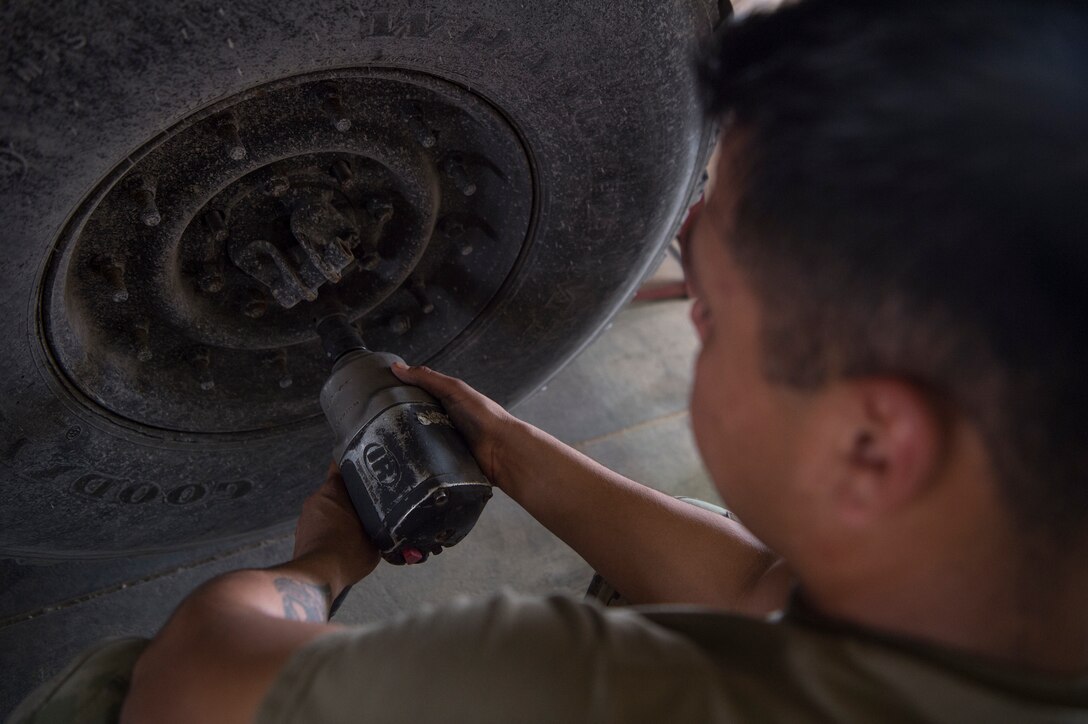 U.S. Army Spc. Abraham Garcia, Echo Company, 1st Battalion, 43rd Air Defense Artillery (ADA) Battalion, 11th ADA Brigade wheeled vehicle mechanic, prepares to rotate a military vehicle’s tires as part of routine maintenance Jan. 28, 2019, at Al Udeid Air Base, Qatar. Soldiers of Echo Company perform mechanical work and repairs for various equipment and assets that support Al Udeid’s air defense capabilities, including surface-to-air missile systems. (U.S. Air Force photo by Tech. Sgt. Christopher Hubenthal)