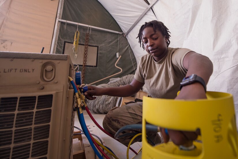 U.S. Army Spc. Shanikka Smith, Echo Company, 1st Battalion, 43rd Air Defense Artillery (ADA) Battalion, 11th ADA Brigade utilities equipment repairer, recovers refrigerant from a Patriot System’s air conditioning unit compressor Jan. 28, 2019, at Al Udeid Air Base, Qatar. Soldiers of Echo Company perform mechanical work and repairs for various equipment and assets that support Al Udeid’s air defense capabilities, including surface-to-air missile systems. (U.S. Air Force photo by Tech. Sgt. Christopher Hubenthal)