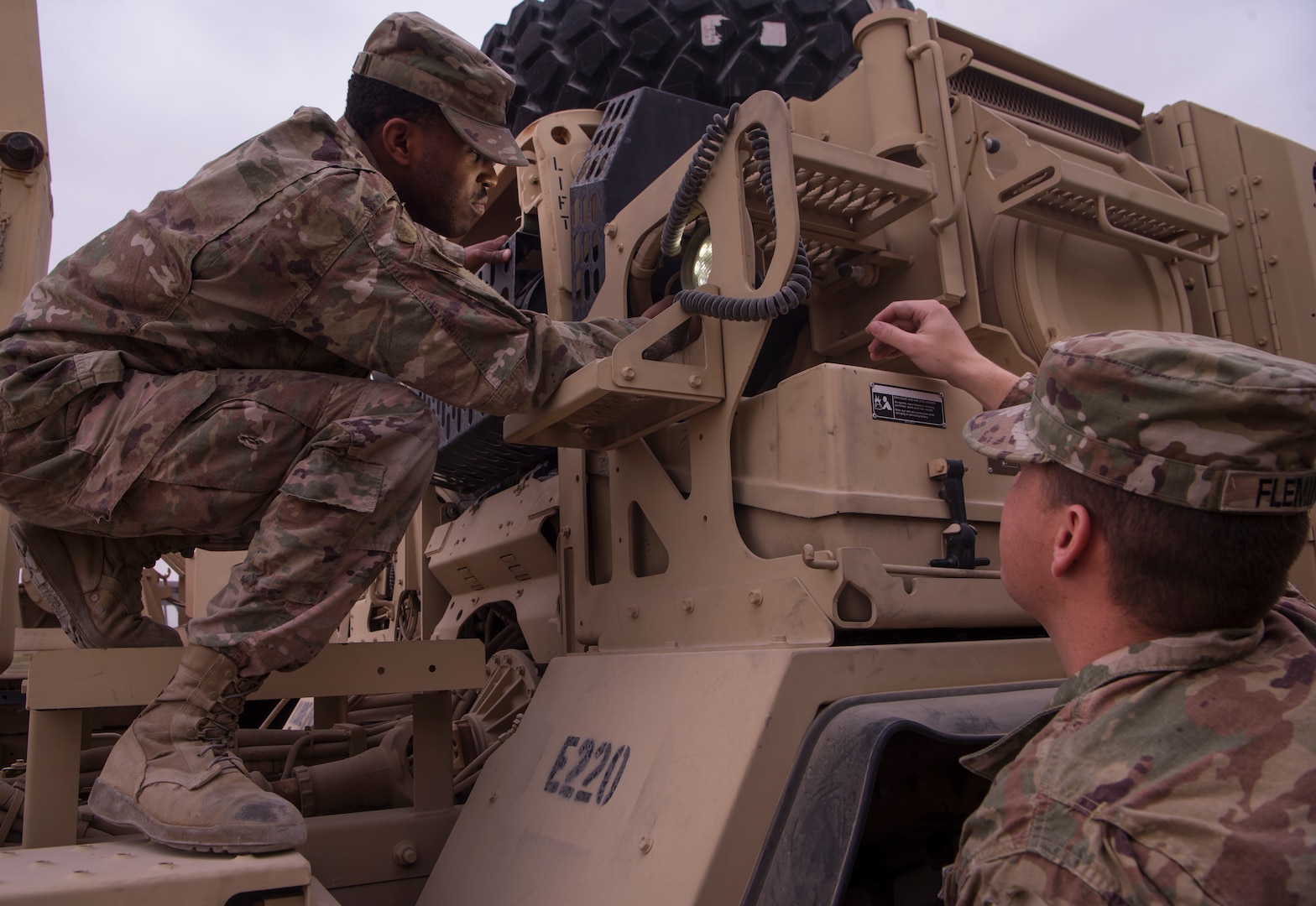 U.S. Army Spc. Jaylyn Wilson, Echo Company, 1st Battalion, 43rd Air Defense Artillery (ADA) Battalion, 11th ADA Brigade wheeled vehicle mechanic (left), and U.S. Army Spc. Brent Fleming, 1-43rd ADA allied trade specialist, conducts an operations check on a Palletized Load System truck Jan. 29, 2019, at Al Udeid Air Base, Qatar. Soldiers of Echo Company perform mechanical work and repairs for various equipment and assets that support Al Udeid’s air defense capabilities, including surface-to-air missile systems. (U.S. Air Force photo by Tech. Sgt. Christopher Hubenthal)