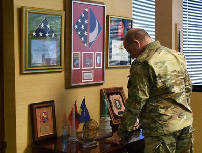 U.S. Army Maj. Gen. Robert E. Livingston, Jr., the adjutant general for South Carolina, looks over memorabilia and plaques in his office at the South Carolina Military Department headquarters in Columbia, South Carolina, Jan. 24, 2019.