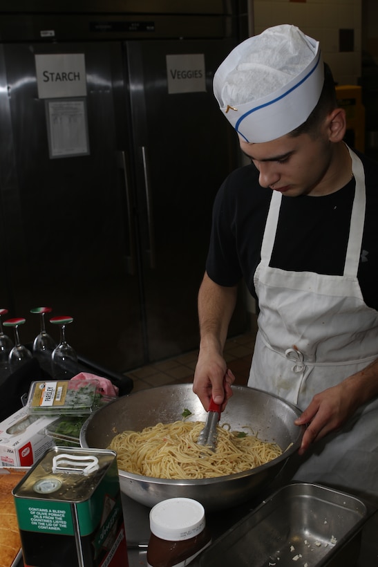 Competitors turn up the heat at the Marine Corps Air Station (MCAS) Cherry Point chow hall to face off for the first fiscal year 2019 Chef of the Quarter at MCAS Cherry Point, N.C., Dec. 7, 2018. The competition is held to shine a light on some of Cherry Point’s most talented food specialists. The winner of each quarter competes at the end of the year for the title of chef of the year. (U.S. Marine Corps photo by Pfc. Jacob Bertram)