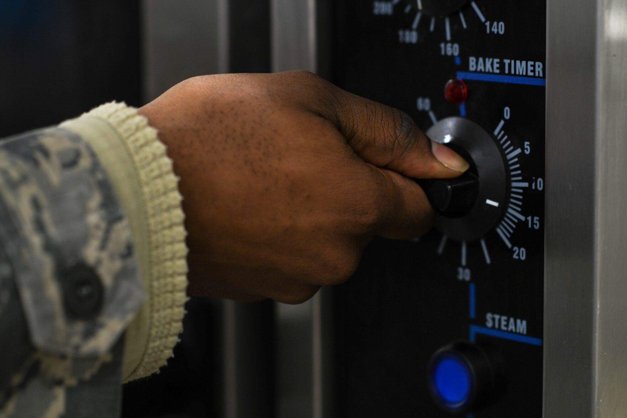 A chef assigned to the 48th Force Support Squadron turns on an oven to prepare food for dinner at the Knight’s Table dining facility on Royal Air Force Lakenheath, England, Jan. 31, 2019. The Knight’s Table is open from 6 to 8:15 a.m., 11 a.m. to 1 p.m., 4:30 to 6:30 p.m., and 11 p.m. to 1 a.m. (U.S. Air Force photo by Senior Airman Malcolm Mayfield)