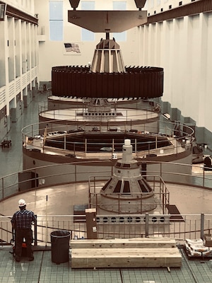 A crane designed to lift 250 tons removes a hydropower generator’s rotor Jan. 17, 2019 at Wolf Creek Power Plant in Jamestown, Ky., to allow the staff access to remove the damaged field pole for refurbishment. (USACE photo by Misty Cravens)