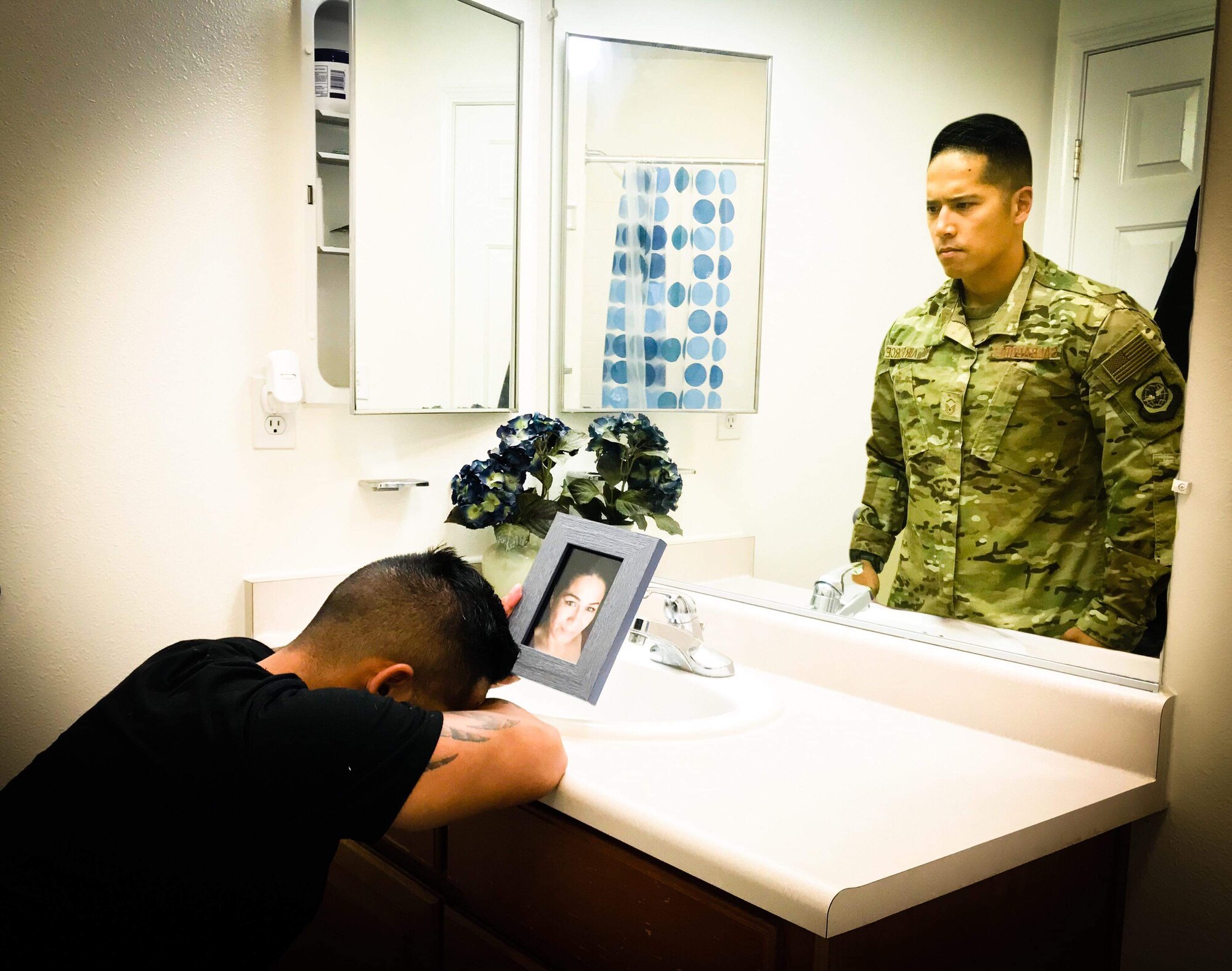 Master Sgt. Christofer Galbadores, 821st Contingency Response Support Squadron security forces training and logistics superintendent at Travis Air Force Base, California, mourns the loss of his mother. Losing his mother tested Galbadores’s faith and his perspective on life. “Physically and mentally, recovery was rough,” he said. “During that journey I lost sight of a few things, but I did learn that sometimes you really have to know darkness to appreciate the light.” (Courtesy Photo Illustration)