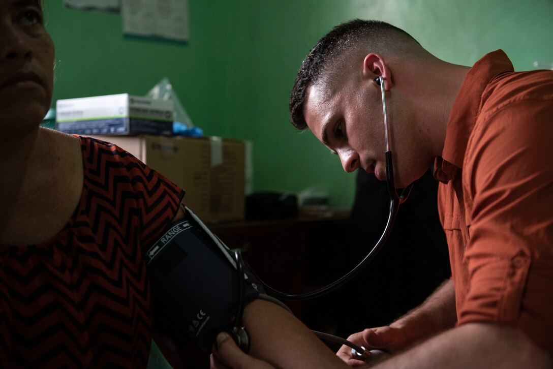 U.S. Army 1st Lt. Luke Emerson, Medical Element emergency room nurse, takes a patient’s blood pressure during a medical readiness exercise in El Palmital, Honduras, Jan. 31, 2019.