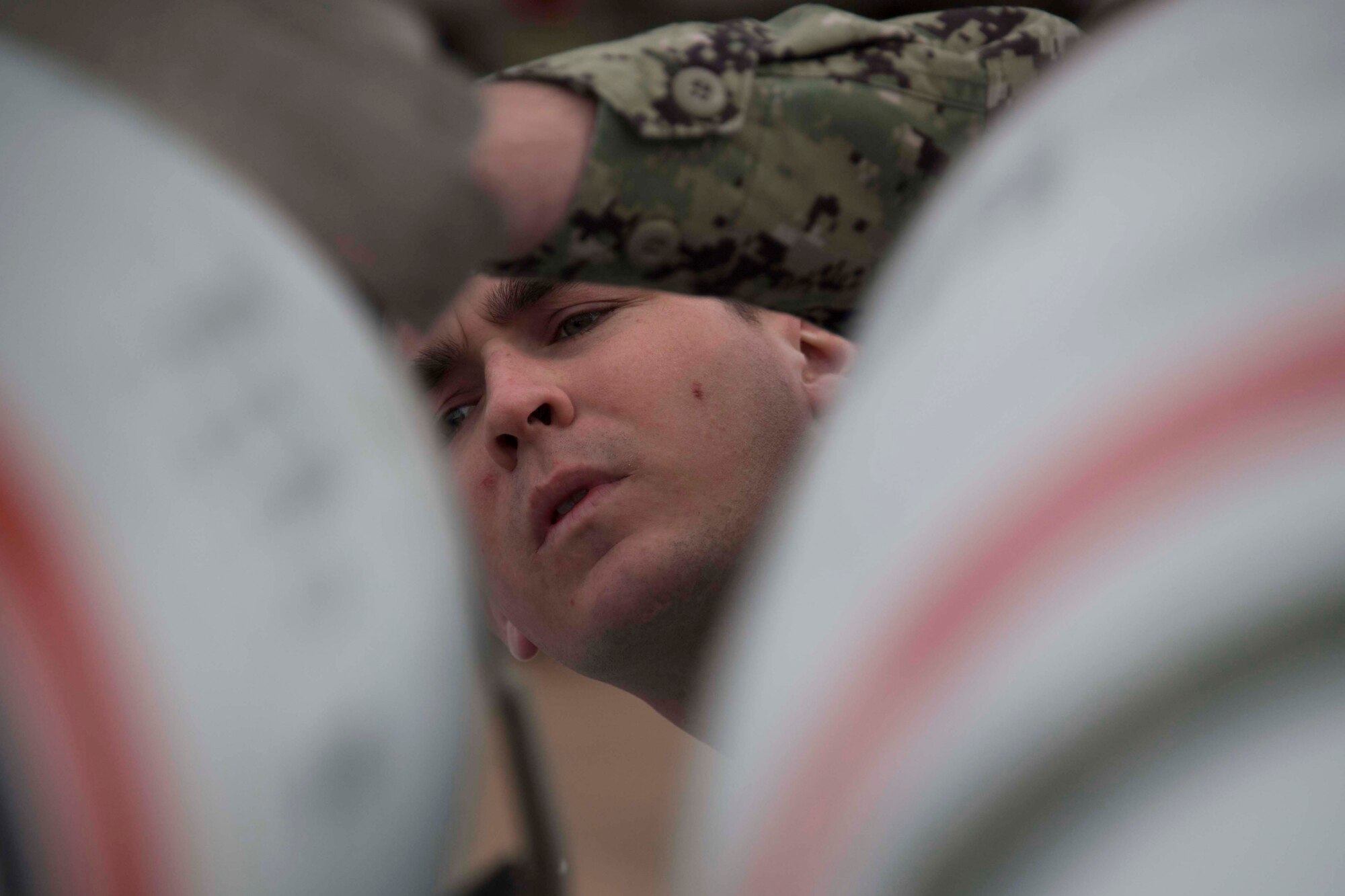 U.S. Navy Petty Officer 1st Class Joshua Royer, a mineman with Navy Munitions Command Atlantic Unit Charleston prepares an inert underwater mine at Barksdale Air Force Base, Louisiana, Jan. 30, 2019.  Royer and several other sailors were at Barksdale AFB to ready the munitions to be loaded aboard a B-52 Stratofortress. (U.S. Air Force photo by Master Sgt. Ted Daigle)
