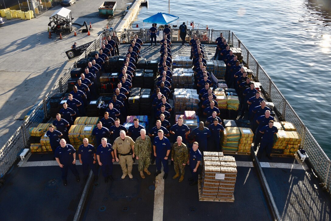 The Coast Guard Cutter Forward (WMEC-911) crew stand amongst 34,780 pounds of interdicted cocaine aboard at Port Everglades, Florida, Feb. 5, 2019