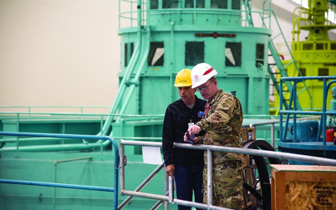 Steve Miles, director of the Hydroelectric Design Center and Col. Aaron Dorf, the commander of Portland District, toured the John Day Lock & Dam powerhouse.