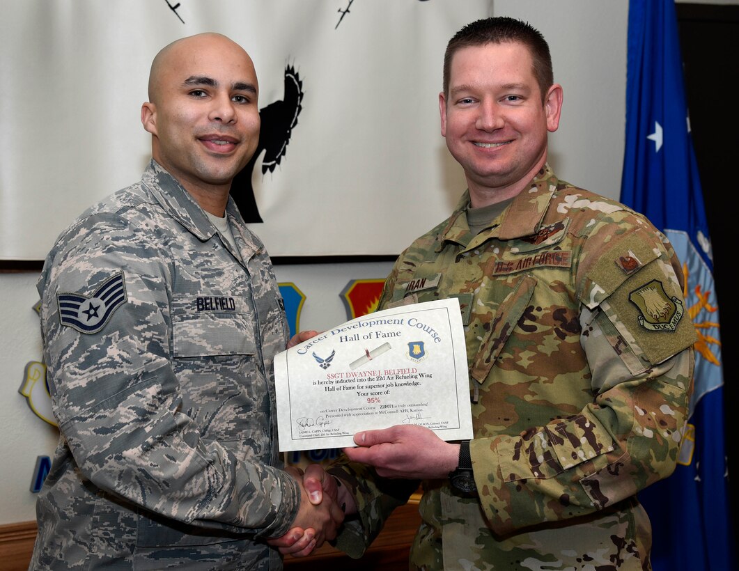 Staff Sgt. Dwayne Belfield, 22nd Logistics Readiness Squadron fuel service center controller, is recognized by Col. Mark Baran, 22nd Air Refueling Wing vice commander, for earning a score of 95 percent on his Career Development Course Feb. 5, 2019, at McConnell Air Force Base, Kan. CDCs help enlisted personnel complete the specialty knowledge portion of on-the-job training for their specific career fields.