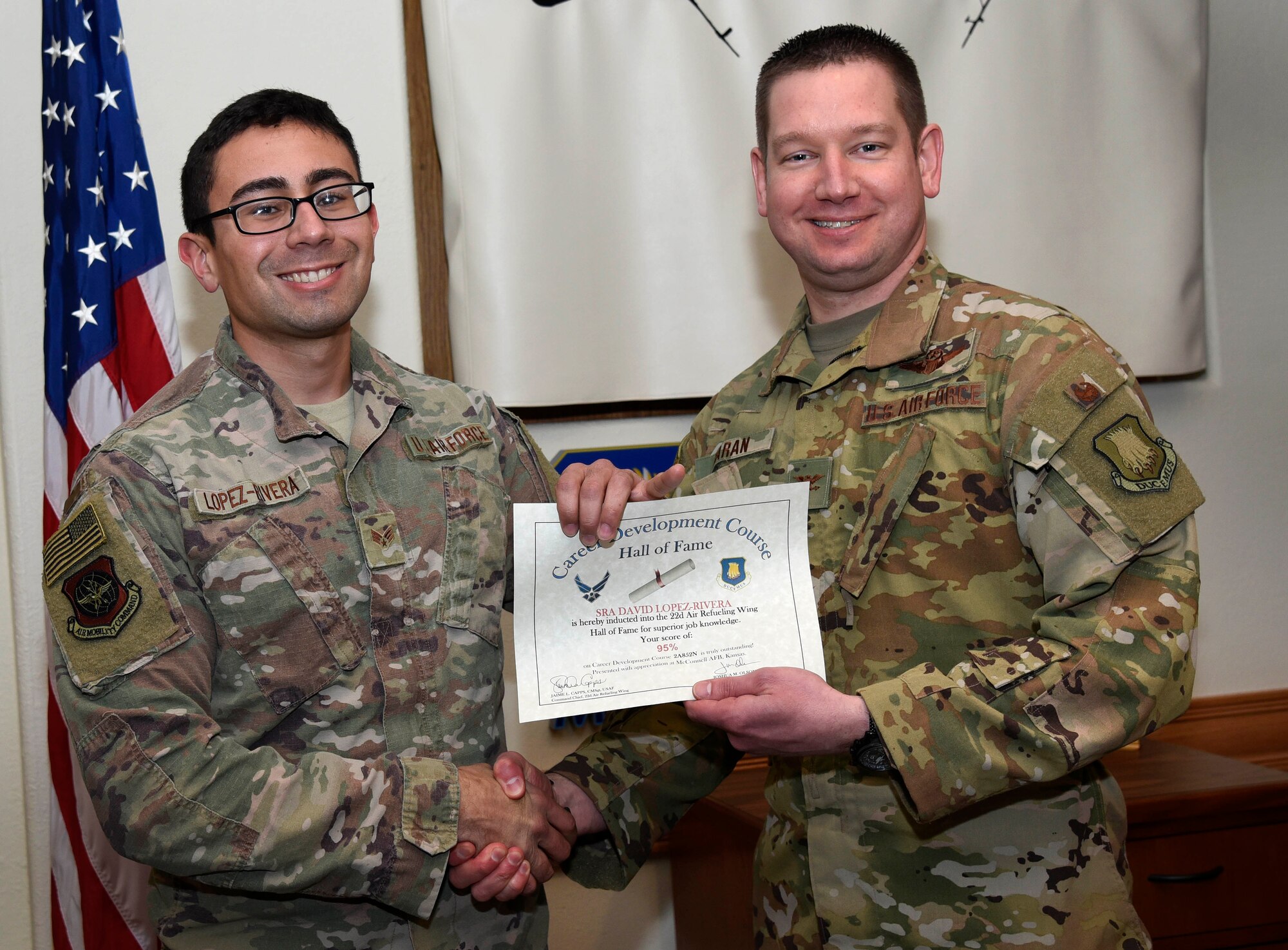 Senior Airman David Lopez-Rivera, 22nd Aircraft Maintenance Squadron guidance and control systems apprentice, is recognized by Col. Mark Baran, 22nd Air Refueling Wing vice commander, for earning a score of 95 percent on his Career Development Course Feb. 5, 2019, at McConnell Air Force Base, Kan. CDCs help enlisted personnel complete the specialty knowledge portion of on-the-job training for their specific career fields.