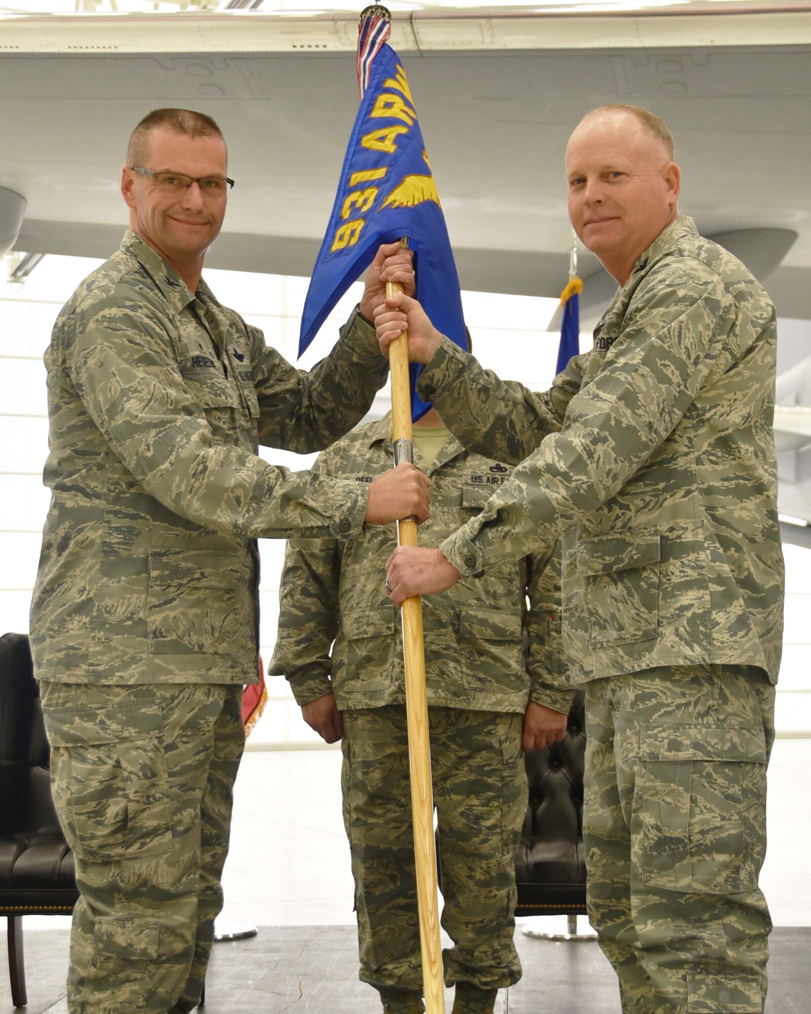 (Left to right) Col. Phil Heseltine, 931st Air Refueling Wing commander, takes the guidon from Col. Heath Fowler, the outgoing 931st Maintenance Group commander, during an official change of command ceremony, Feb. 3, 2019, McConnell Air Force Base, Kan. Fowler was the first commander of the 931 MXG, which stood up in 2016.
