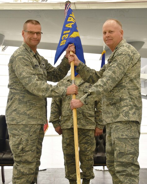 (Left to right) Col. Phil Heseltine, 931st Air Refueling Wing commander, takes the guidon from Col. Heath Fowler, the outgoing 931st Maintenance Group commander, during an official change of command ceremony, Feb. 3, 2019, McConnell Air Force Base, Kan. Fowler was the first commander of the 931 MXG, which stood up in 2016.