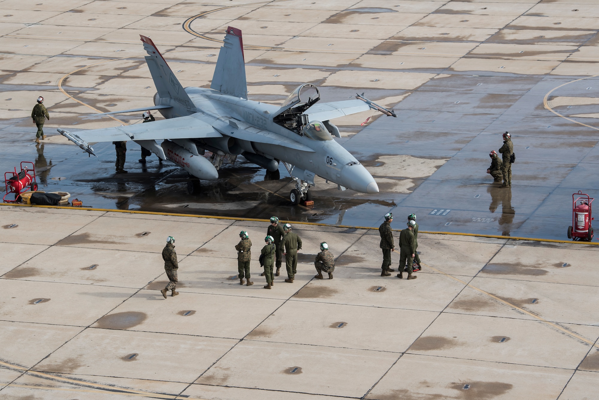 A U.S. Marine Corps F/A-18C Hornet and aircrew inspect the aircraft during joint exercise Winter Fury at Marine Corps Air Station Miramar, San Diego, Calif., Jan. 16, 2019. Winter Fury involved both Marine F/A-18C Hornets, and Navy F-35C Lightning II’s, partnering with Air Force F-22 Raptors to perform air-to-air combat, while protecting ground assets.
