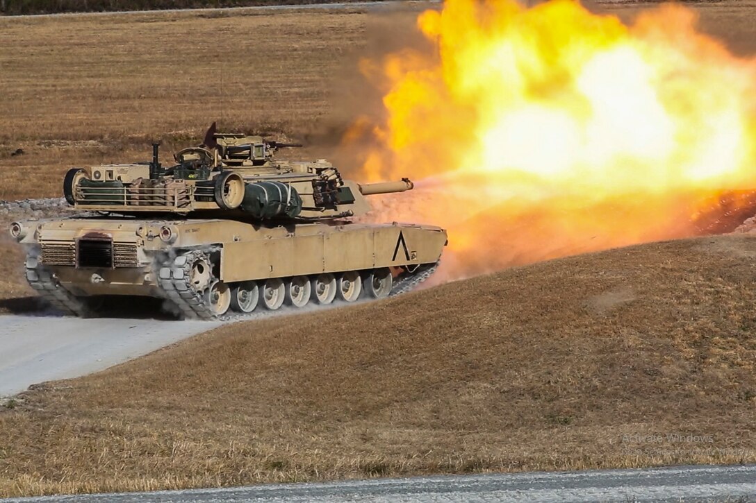 A tank fires its main gun.