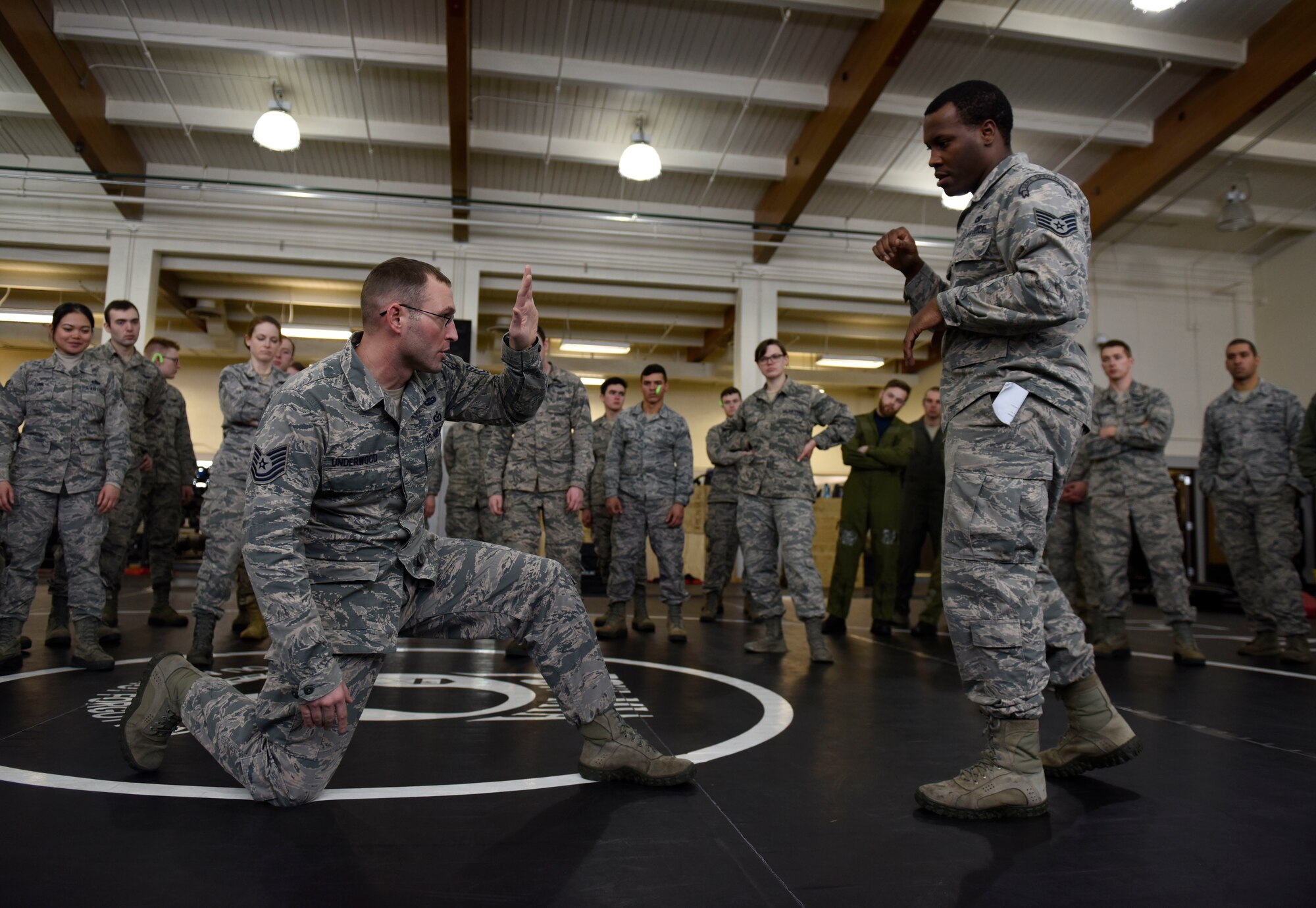 U.S. Air Force Tech. Sgt. Jarad Underwood, 22nd Training Squadron Advanced Skills Training NCO in charge, and Staff Sgt. Corray Valentine, 22nd TRS AST instructor, demonstrate a “shield block” during a combat survival training for aircrew and battlefield Airmen at Fairchild Air Force Base, Washington, Jan. 31, 2019. Underwood is the first and only person in the Department of Defense who is eligible to teach combatives to members in all military branches. (U.S. Air Force photo/Senior Airman Jesenia Landaverde)