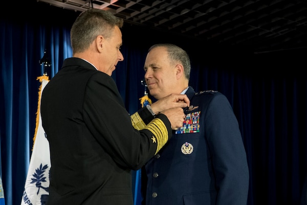 U.S. Navy Adm. Philip S. Davidson, commander, U.S. Indo-Pacific Command, presents U.S. Air Force Lt. Gen Jerry P. Martinez with the Defense Distinguished Service Medal during the United States Forces Japan and 5th Air Force change of command ceremony at Yokota Air Base, Japan, Feb. 5, 2019. During the ceremony, U.S. Air Force Lt. Gen. Kevin B. Schneider assumed command of USFJ and 5th AF from Martinez. (U.S. Air Force photo by Senior Airman Donald Hudson)