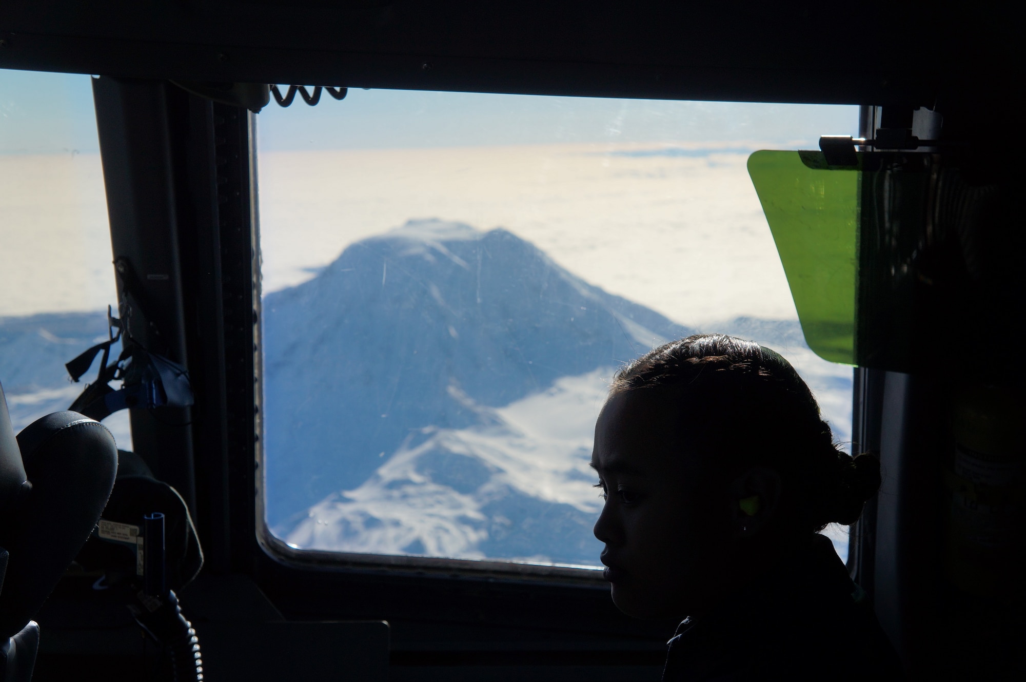 Cadet Chellvi Taijeron, a senior at Bethel High School, watches Reserve Citizen Airmen from the 313th Airlift Squadron piloting the C-17 Globemaster III aircraft during an orientation flight in January. (Courtesy photo)