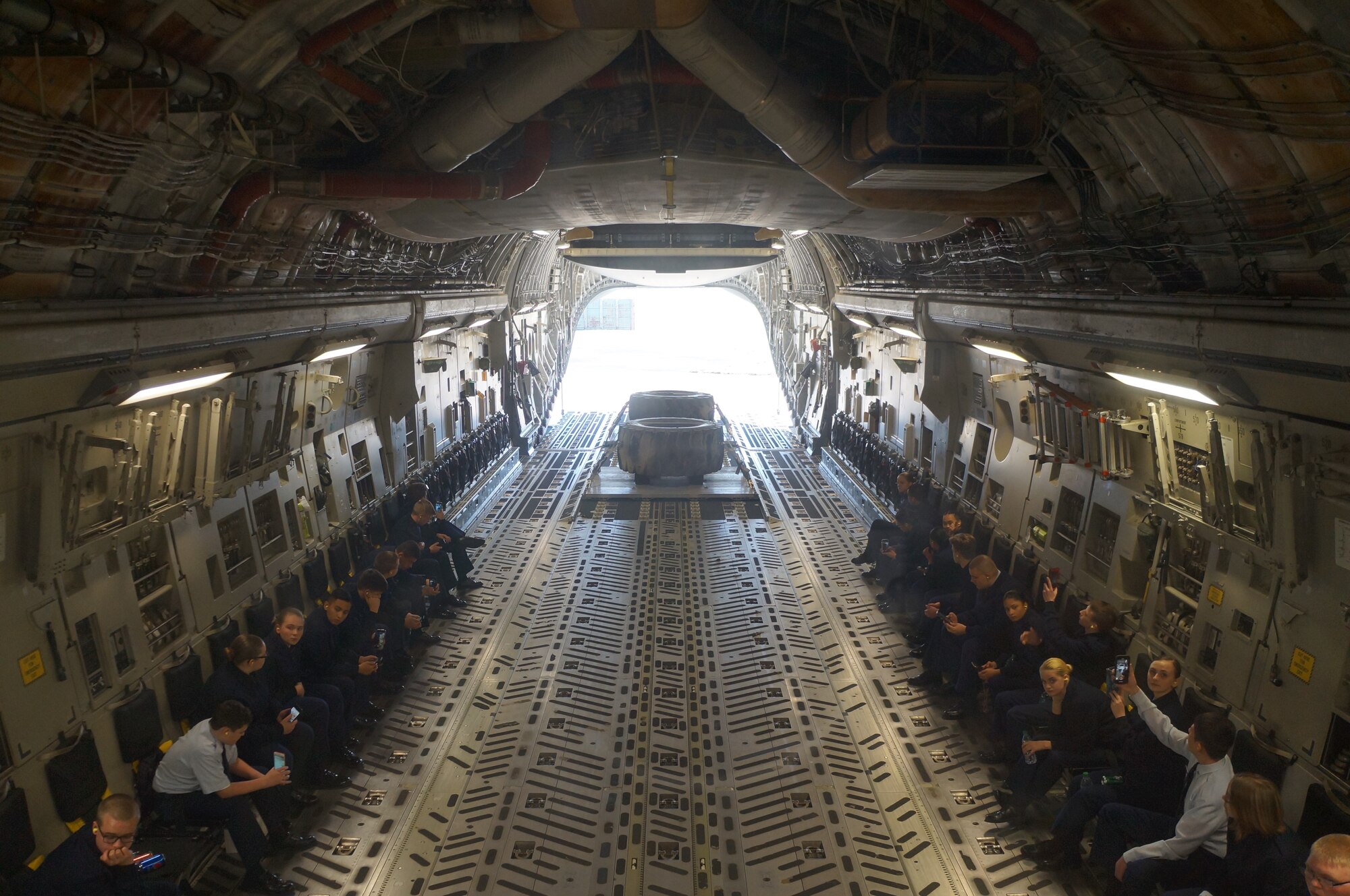 Cadets with Bethel High School JROTC await for a combat offload demo on a C-17 Globemaster III in January at McChord Field. The cadets got to experience an orientation flight aboard the C-17 cargo aircraft. (Courtesy photo)