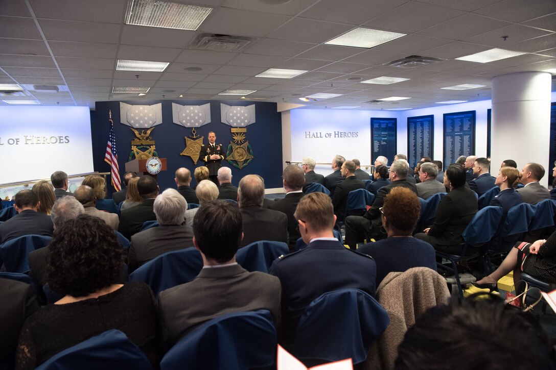 Army general speaks at lectern speaks