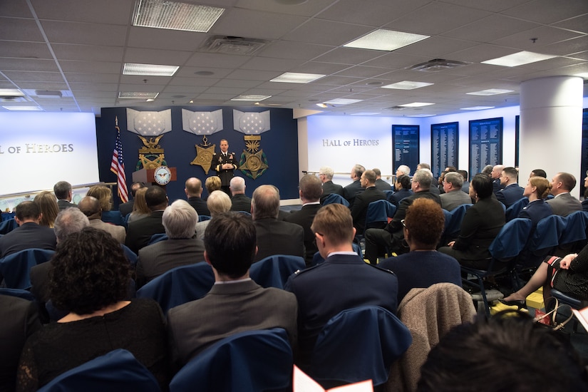 Army general speaks at lectern speaks