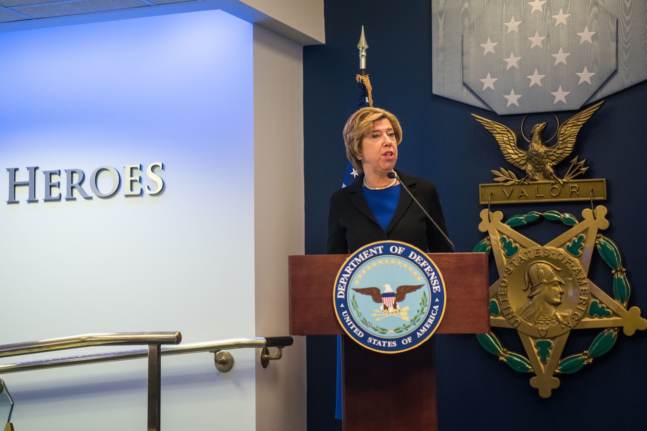 Woman speaks at lectern