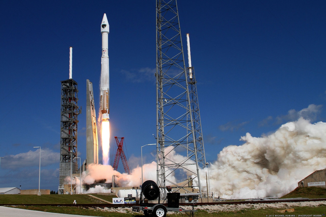 A rocket takes off from a launch pad.