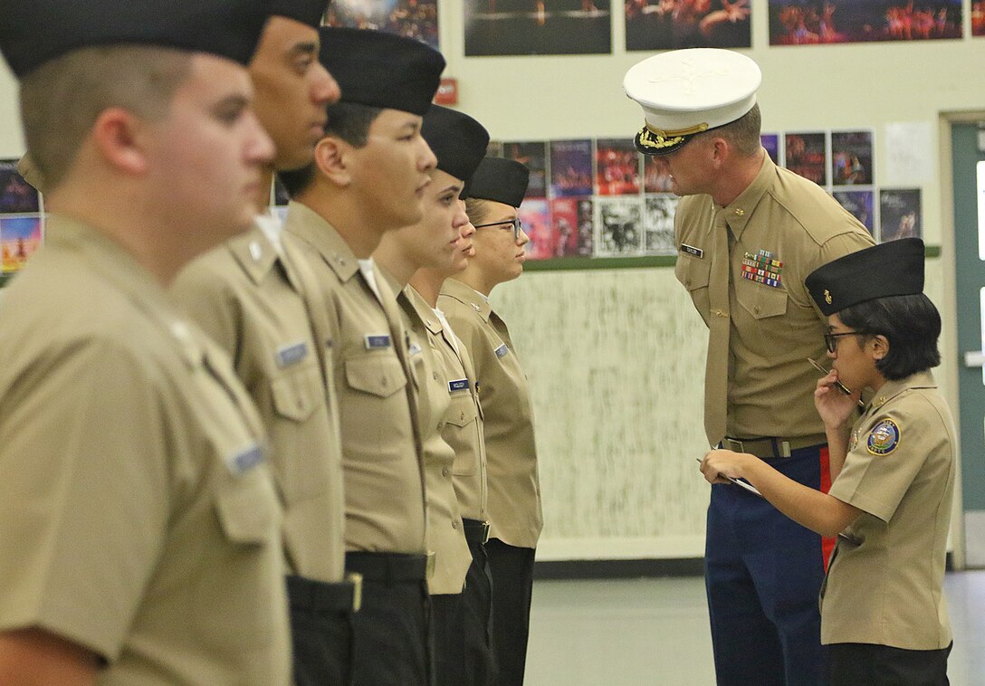 U.S. Marine Corps Major Adam Taylor, commanding officer of Marine Corps Recruiting Station Orange County, inspects cadets from the Navy Junior Reserve Officer Training Corps during the Area 11 Field Meet Championship at Santa Ana High School, Santa Ana, Calif., Feb. 2, 2019. Units from across southern California participated in multiple events and were judged on military bearing, knowledge and precision during team events. This is one of the many ways local recruiting commands support their communities and help develop America's youth.
