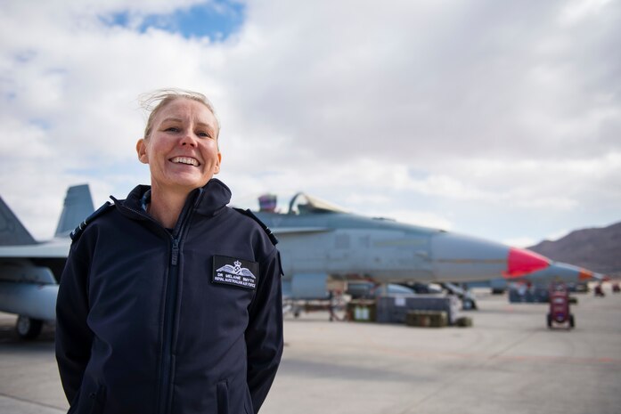 A Royal Australian Air Force Airman poses in front of a jet in Las Vegas