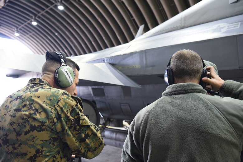 U.S. Marine Corps Sgt. Maj. Anthony Spadaro, U.S. Pacific Command senior enlisted leader, left, watches a 51st Maintenance Squadron crew chief perform pre-flight procedures at Osan Air Base, Republic of Korea, Jan. 28, 2019. During his tour of Osan, Spadaro observed how enlisted members performed their daily jobs and tasks. (U.S. Air Force photo by Airman 1st Class Ilyana A. Escalona)