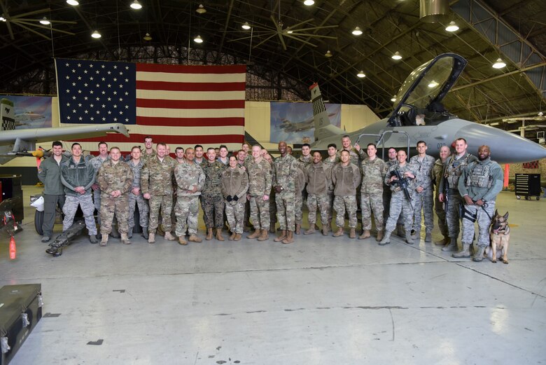 U.S. Marine Corps Sgt. Maj. Anthony Spadaro, U.S. Pacific Command senior enlisted leader, poses for a photo alongside members of Team Osan at Osan Air Base, Republic of Korea, Jan. 28, 2019. Members from various Osan units briefed Spadaro about their capabilities and their contributions to the success of the wing mission. (U.S. Air Force photo by Airman 1st Class Ilyana A. Escalona)