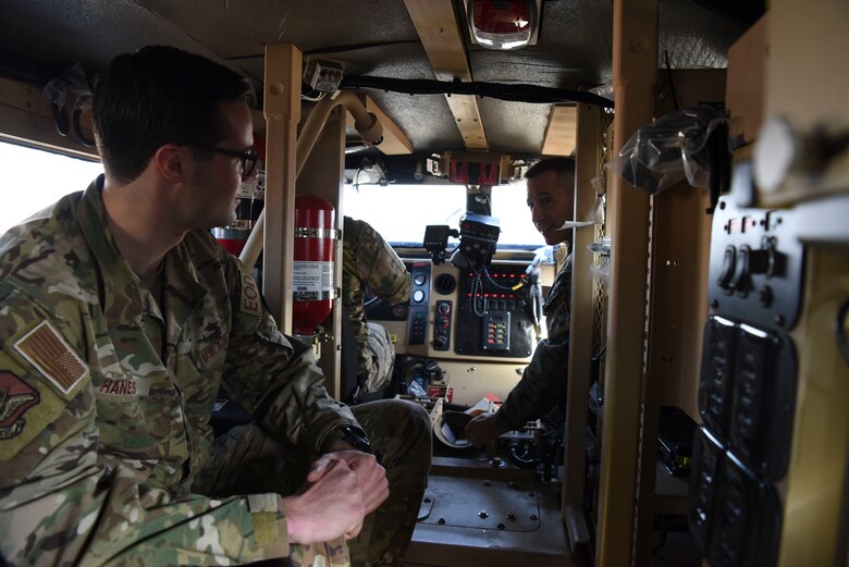 U.S. Marine Corps Sgt. Maj. Anthony Spadaro, right, U.S. Pacific Command senior enlisted leader, discusses the operational uses of the joint explosive ordnance disposal rapid response vehicle with Senior Airman Gideon Hanes, 51st Civil Engineer squadron EOD technician, at Osan Air Base, Republic of Korea, Jan. 28, 2019. During his visit to Osan, Spadaro was briefed about the skills various units on base possessed. (U.S. Air Force photo by Airman 1st Class Ilyana A. Escalona)