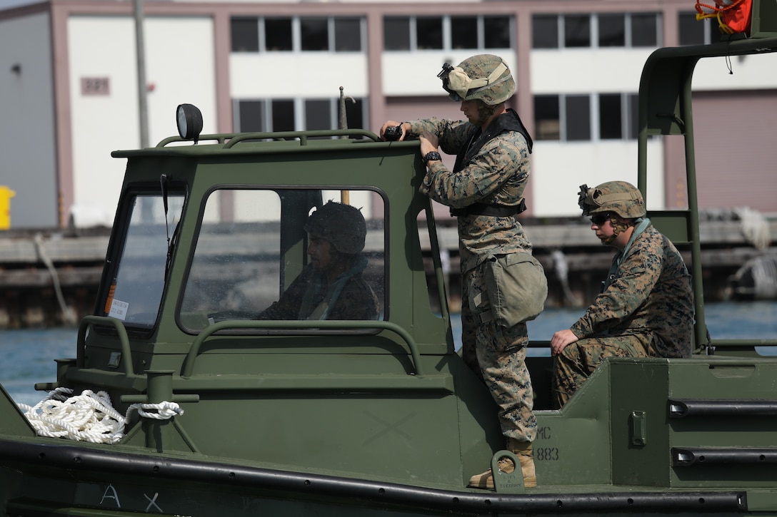 Combat engineers practice high speed maneuvers in bridge erection boats (BEBs) Jan. 29, 2019 at Naha Military Port. The Marines with Improved Ribbon Bridge Platoon, Bridge Company, 9th Engineer Support Battalion, 3rd Marine Logistics Group are designated as BEB operators, who were tested on a series of maneuvers at the port in order to attain BEB licenses. BEBS are used to move and connect Improved Ribbon Bridge (IRB) bays, which is a tactical bridging system that can span across bodies of water greater than 100 meters. Tactical bridging, specifically wet-gap crossing, is a unique function within logistics combat element of the Marine Air-Ground Task Force and ensures mobility across rivers and waterways throughout the Indo-Pacific area of operations.  (U.S. Marine Corps photo by Sgt. Tiffany Edwards