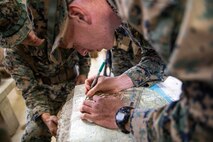 Cpl. Caleb Richters plots points points on a map during land navigation training Jan. 29, 2019 at Jungle Warfare Training Center, Camp Gonsalves, Okinawa, Japan. The purpose of the Jungle Warfare Training Center is to teach Marines survival skills needed for the jungle, as well as build unit cohesion and small unit leadership. Richters is a network administrator with Networking Platoon, Communications Company, Combat Logistics Regiment 37, 3rd Marine Logistics Group. Richters is a native of Coram, New York. (U.S. Marine Corps photo by Lance Cpl. Terry Wong)