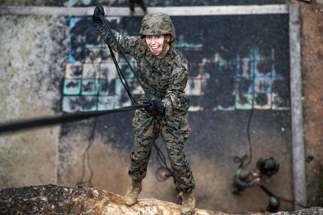 U.S. Navy Hospital Corpsman 2nd Class Felecia Eaton rappels down a cliff during training Jan. 29, 2019, at Jungle Warfare Training Center, Camp Gonsalves, Okinawa, Japan. The purpose of the Jungle Warfare Training Center is to teach Marines survival skills needed for the jungle, as well as build unit cohesion and small unit leadership. Eaton is a fleet Marine service technician with Combat Logistics Regiment 37, 3rd Marine Logistics Group. Eaton is a native of Talladega, Alabama. (U.S. Marine Corps photo by Lance Cpl. Terry Wong)