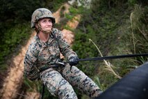 Sgt. Marrissa Ladwig applies rappelling techniques learned during training Jan. 29, 2019, at Jungle Warfare Training Center, Camp Gonsalves, Okinawa, Japan. The purpose of the Jungle Warfare Training Center is to teach Marines survival skills needed for the jungle, as well as build unit cohesion and small unit leadership. Ladwig is a data systems administrator with Data Systems Platoon, Communications Company, Combat Logistics Regiment 37, 3rd Marine Logistics Group. Ladwig is a native of Custer, Montana. (U.S. Marine Corps photo by Lance Cpl. Terry Wong)
