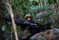 Sgt. Marrissa Ladwig searches for the enemy during a patrol Jan. 30, 2019, at Jungle Warfare Training Center, Camp Gonsalves, Okinawa, Japan. The purpose of the Jungle Warfare Training Center is to teach Marines survival skills needed for the jungle, as well as build unit cohesion and small unit leadership. Ladwig is a data systems administrator with Data Systems Platoon, Communications Company, Combat Logistics Regiment 37, 3rd Marine Logistics Group. Ladwig is a native of Custer, Montana. (U.S. Marine Corps photo by Lance Cpl. Terry Wong)