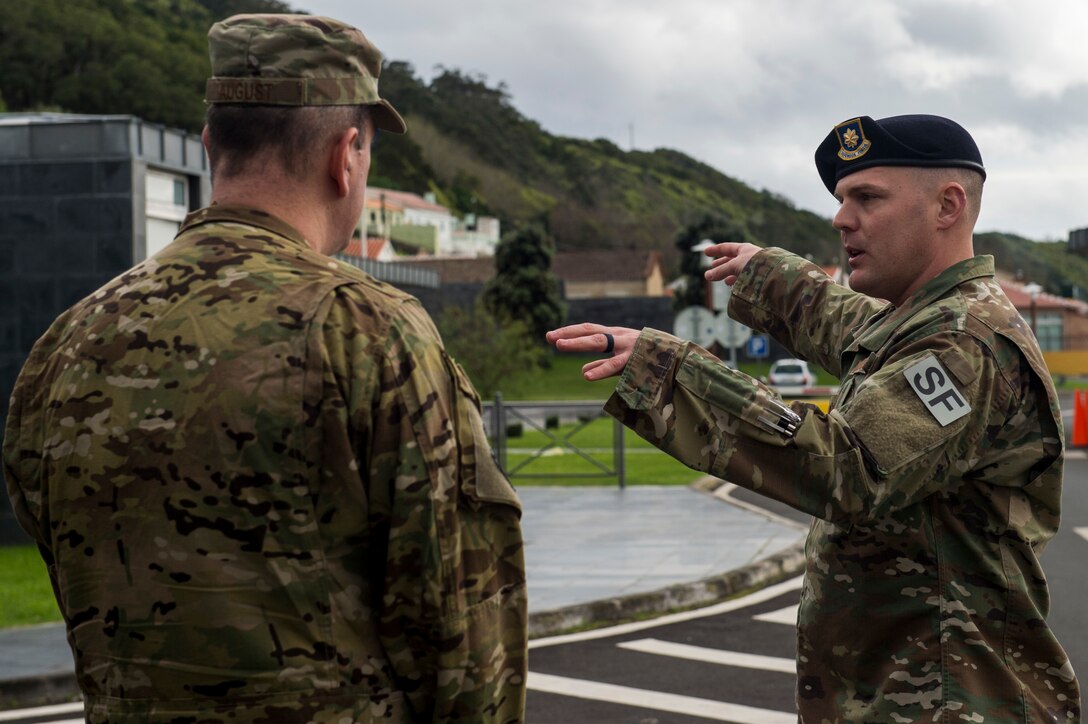 U.S. Air Force Maj. Richard Buckley, 65th Security Forces Squadron commander (right), discusses security details with U.S. Air Force Brig. Gen. Mark R. August, 86th Airlift Wing commander (left), at Lajes Air Field, Azores, Jan. 30, 2019. Discussed installation security and increased interoperability with the Porteguese air force. (U.S. Air Force photo by Staff Sgt. Jonathan Bass)