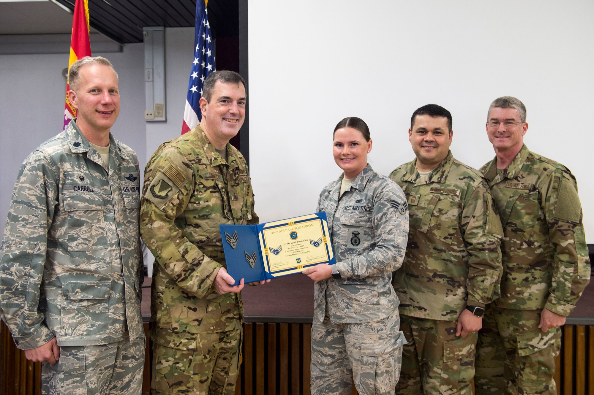 U.S. Air Force Senior Airman Heavenly Carey, 496th Air Base Squadron patrolman, receives her promotion certificate during an all-call on Moròn Air Base, Spain, Jan. 31, 2019. The purpose of the all-call was to review 2018 and prepare for 2019. (U.S.Air Force photo by Staff Sgt. Jonathan Bass)