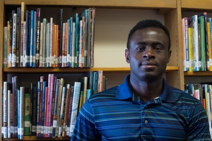 U.S. Army Staff Sgt. Venance Akissi, Charlie Company, 1st Battalion, 210th Aviation Regiment, 128th Avn.  Brigade instructor, volunteers at the Groninger Library at Joint Base Langley-Eustis, Virginia.