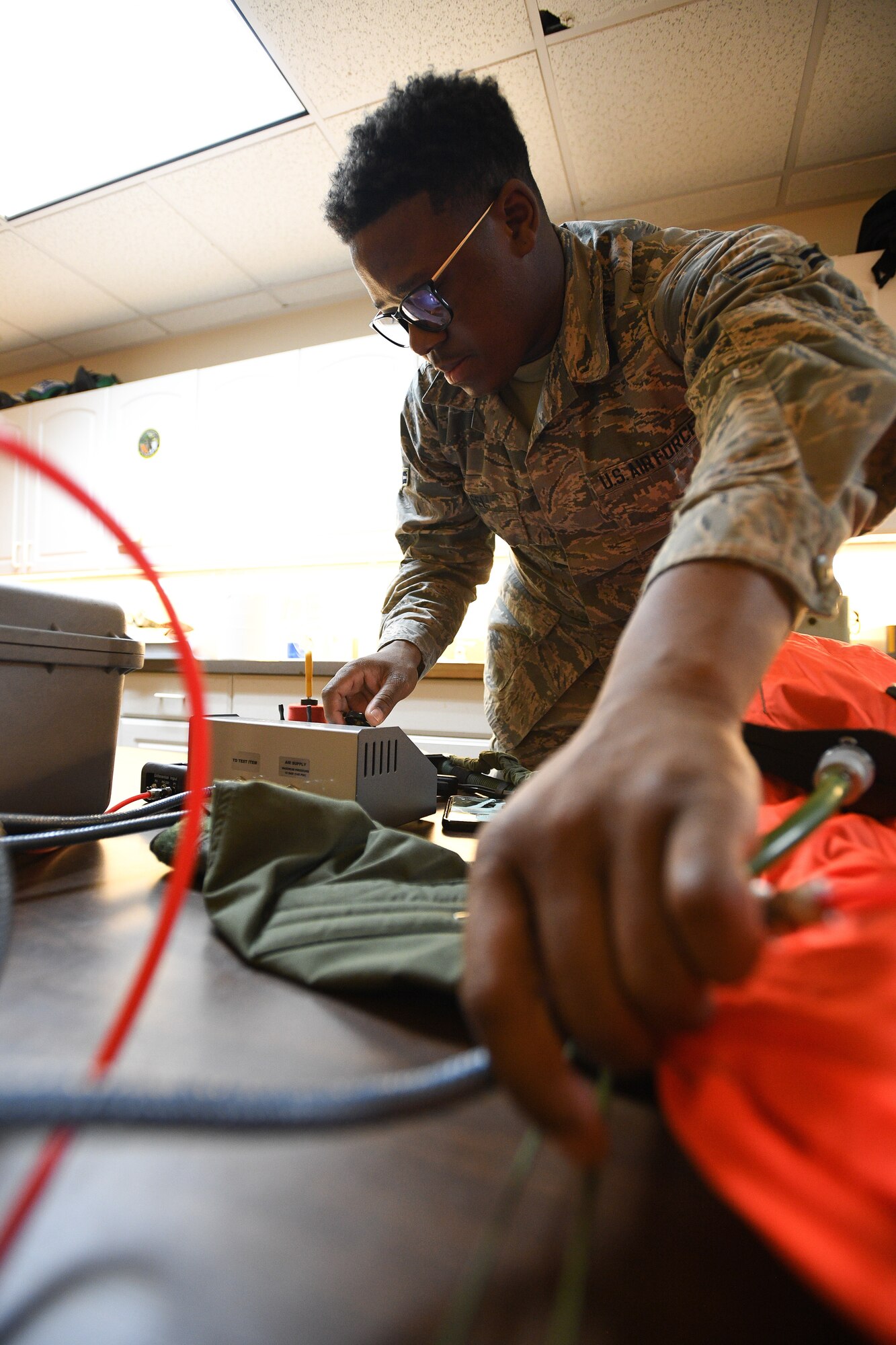 388th Operations Support Squadron Aircrew Flight Equipment shop, works on flight equipment, Nellis Air Force Base, Nevada, Feb. 5, 2019. AFE Airmen manage, check and prepare gear pilots need to fly and also survive in the event of an emergency. (U.S. Air Force photo by R. Nial Bradshaw)